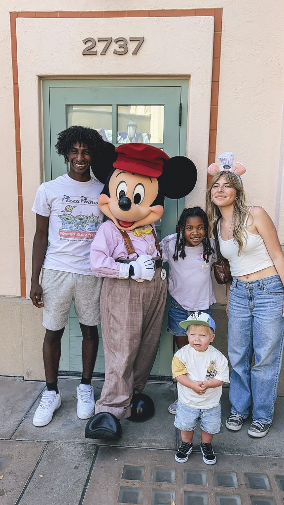 Disneyland vs California Adventure: How to Choose When You Only Have 1 Day! 3 kids standing with Mickey Mouse in California Adventure