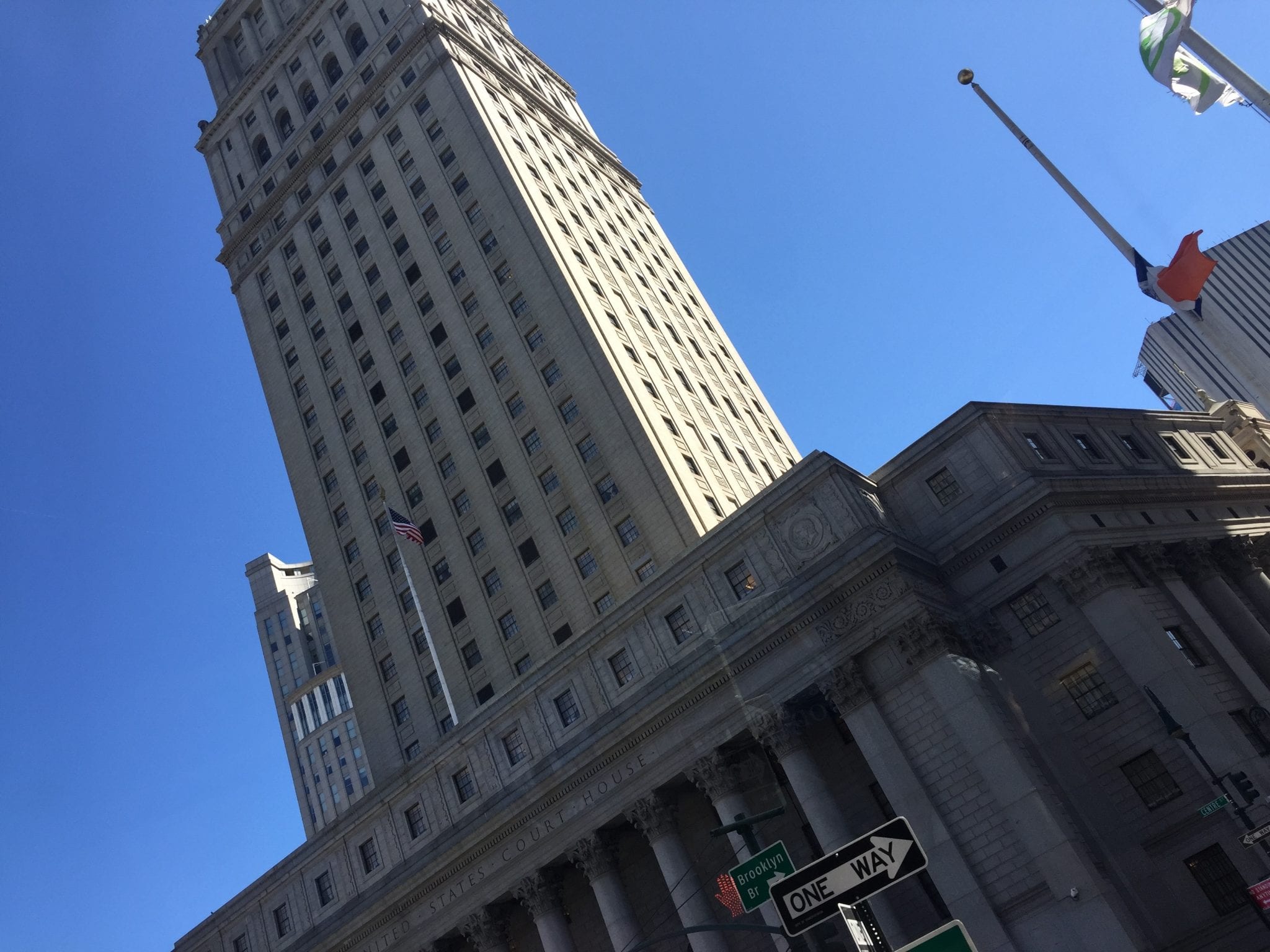 A photo looking up at the Empire State Building | Global Munchkins